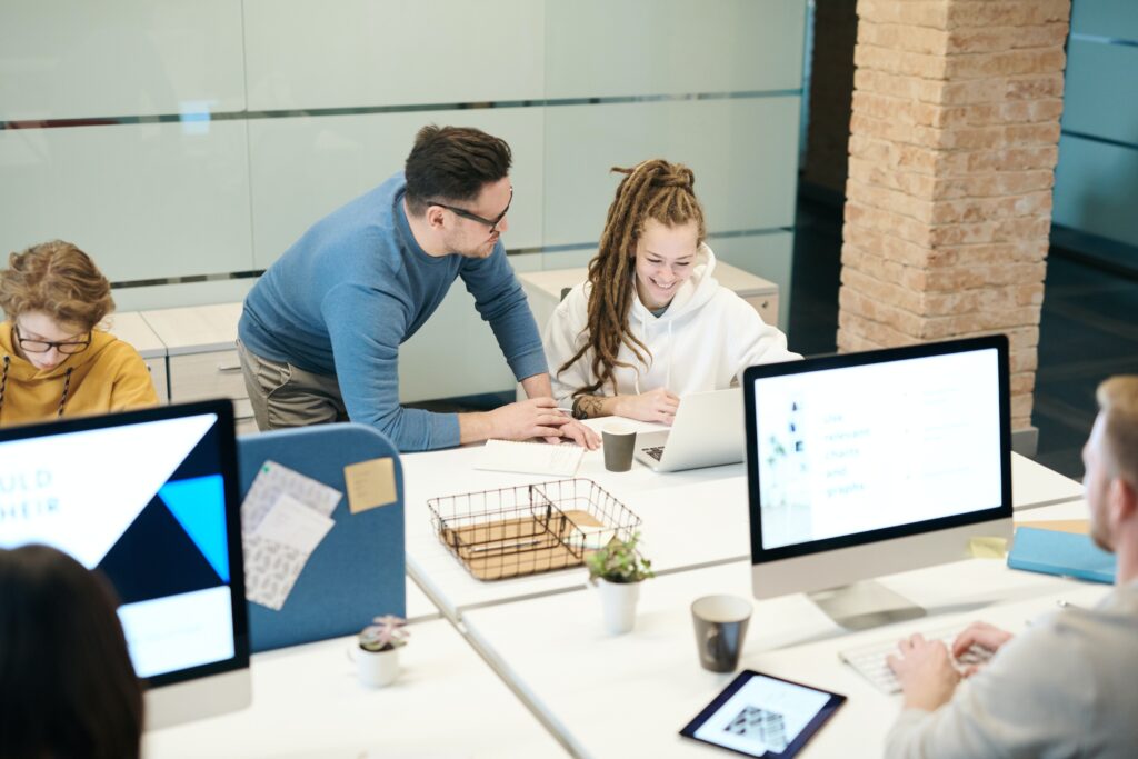 people working at desk collaboratively